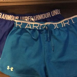 two pairs of underarmour shorts
